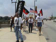 Team walks across the bridge to City Hall