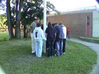 Christian students praying at flaf pole - Click for larger view