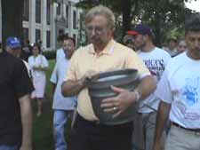 David Lackey carries brazier all around town