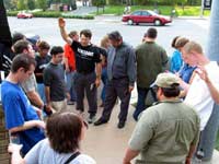 The saints close in prayer, thankful for the opportunities to minister to the homosexuals and grateful to the Lord for His protection. - Click image for larger view